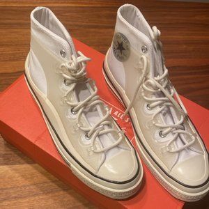 A futuristic, transparent cage lace up on a cotton high-top, chunky, rubber sole